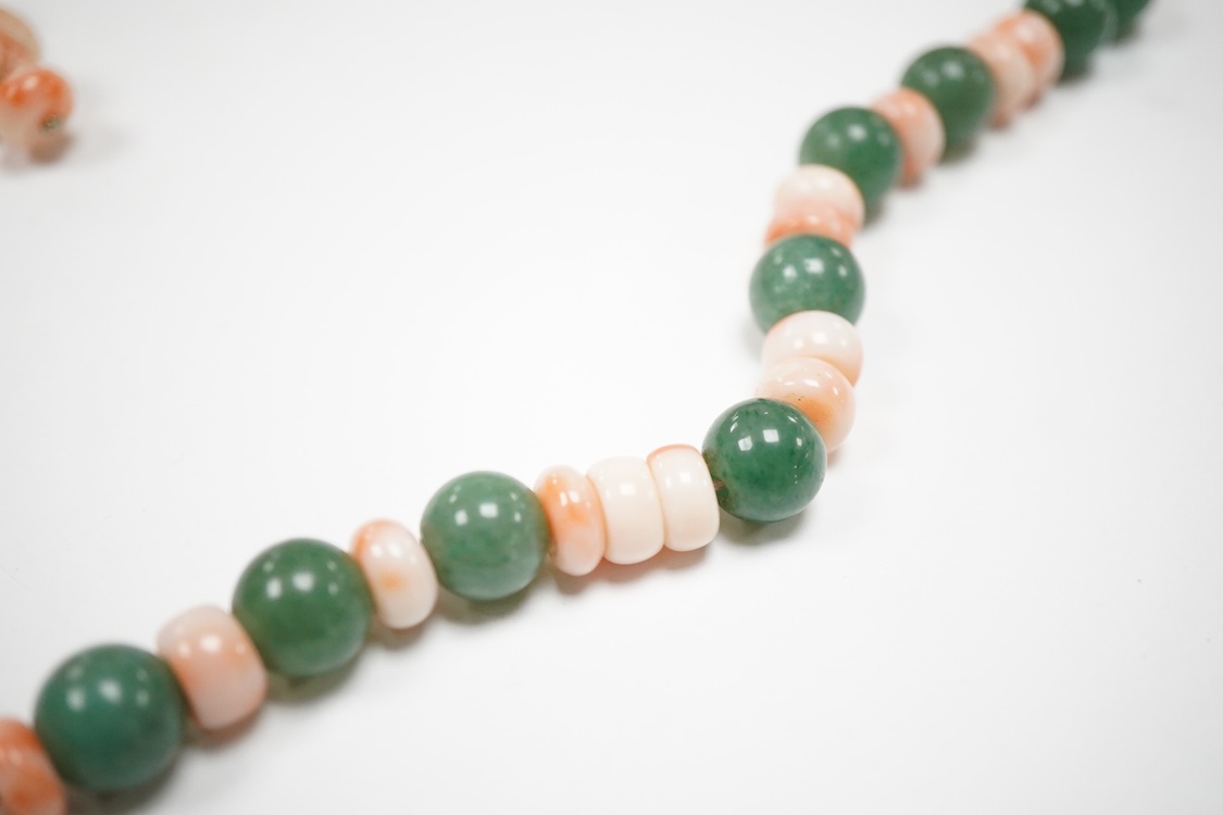 A 20th century adventurine quartz and coral bead set necklace, with a 925 clasp, 80cm, together with a similar carved coral line drop pendant, with a 750 white metal clasp.